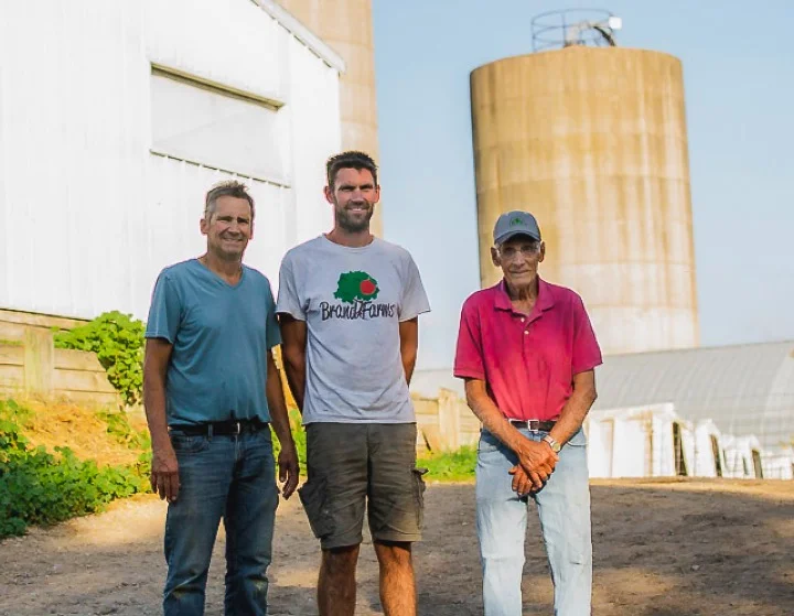 Three of the four generations of the Brand family at the farm