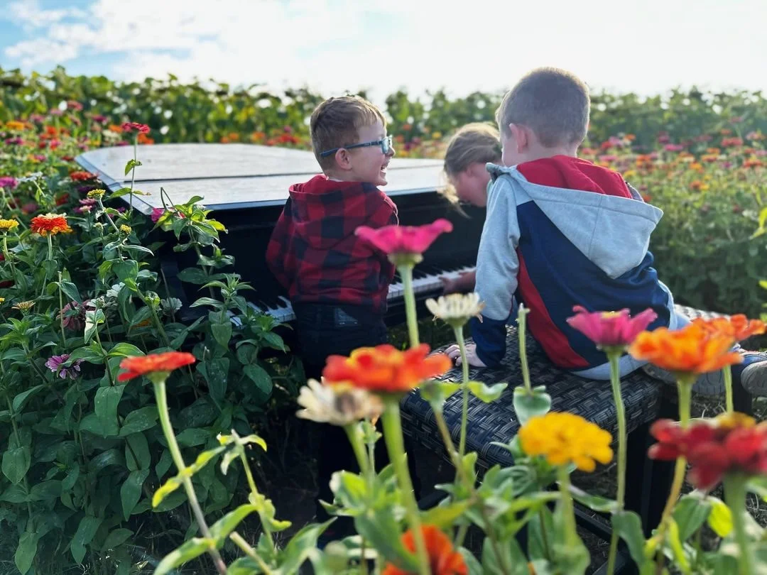 Happy children enjoying flowers at Brand Farms